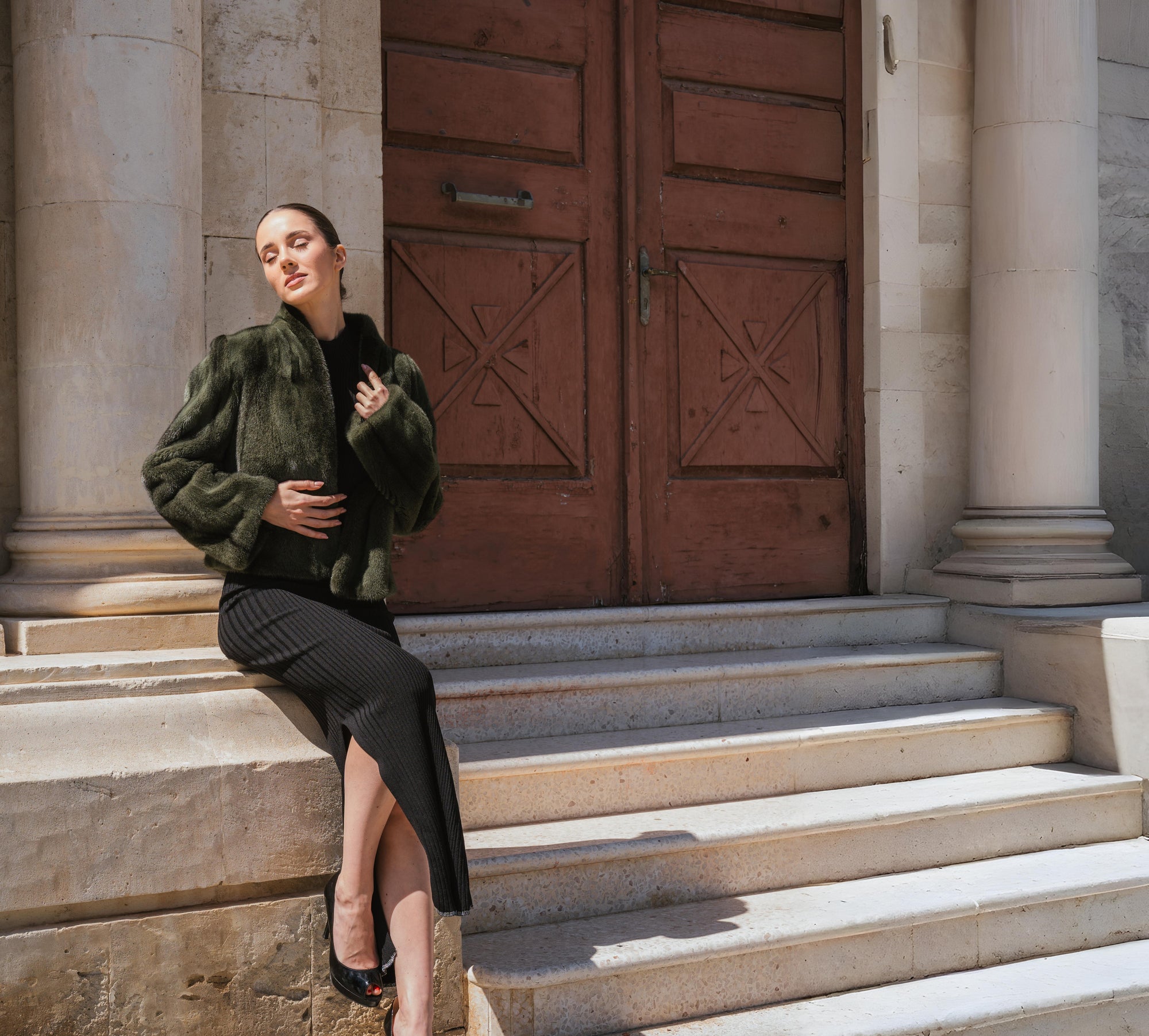 Green mink coat worn by model in cyprus