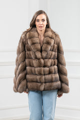 Russian sable short jacket with horizontal panels on the body and vertical chevron piecing on the sleeves, featuring a wide lapel collar.