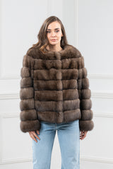 Brown Russian sable fur jacket featuring a collarless round neckline and horizontal panel construction throughout the body and sleeves.