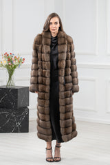 Russian sable fur coat featuring a long silhouette with a wide collar and horizontal paneling throughout the body and sleeves.