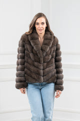 Carbonio silvery Russian sable short jacket featuring a V-chevron pattern, a plush wide collar, and long sleeves with horizontal fur bands.