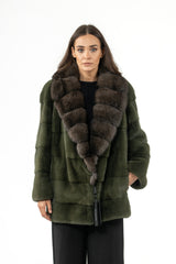 Dark olive mink short jacket with horizontal panels and a large, plush, dark brown fur collar. Includes a MANZARI brand tag at the hem.