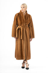 Gold mink fur coat with vertical pelts, featuring a standing collar, wide sleeves, and a matching fur tie belt at the waist.