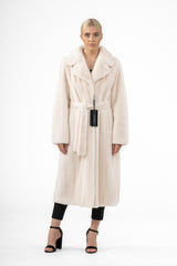 Pearl mink fur coat in a full-length silhouette with a wide lapel collar, long sleeves, and a matching self-tie waist belt, shown front-facing.