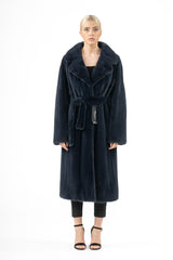 A night sky blue mink fur coat featuring a wide notched lapel, long sleeves, and a matching self-tie belt around the waist, shown from the front.