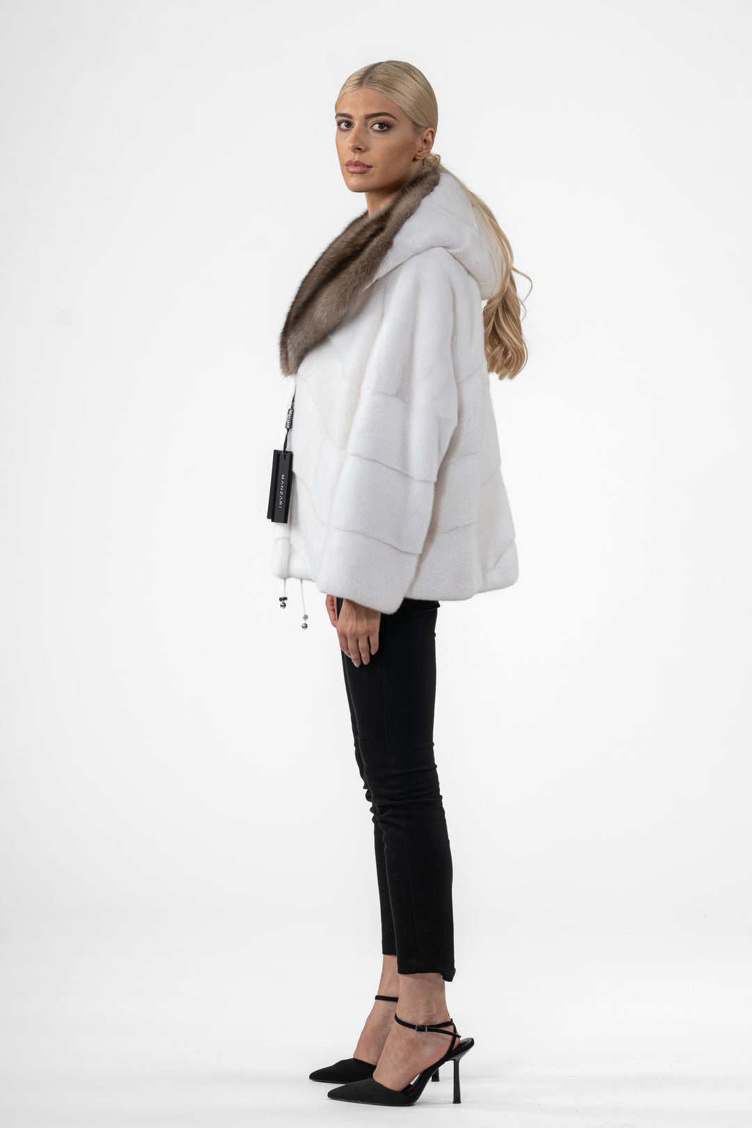 Model wearing a White Mink fur coat