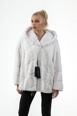 White mink fur short jacket with hood featuring a decorative V chevron panel pattern on the body and sleeves, finished with a button closure.