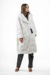 White mink fur jacket with a hood, featuring a V-chevron pattern on the body and horizontal panels on the sleeves.