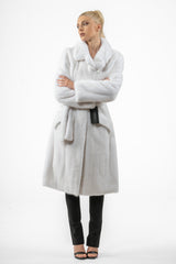 White mink fur jacket with a wide collar, long sleeves, and a matching waist tie. Features a clean, straight-fit silhouette with vertical pelts.