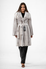 Silverblue cross mink jacket with a large lapel collar, vertical fur grain, and a matching tie belt at the waist.