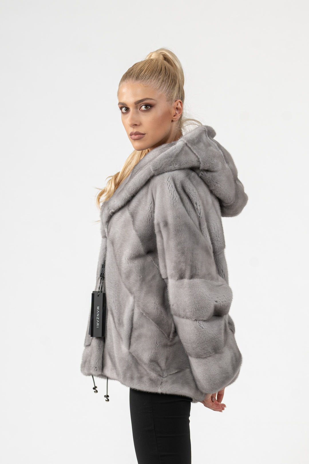 Model wearing a Sapphire Mink fur coat
