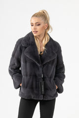 A short Grafite velvet mink fur jacket featuring horizontal panels, a notched collar, and a button closure.