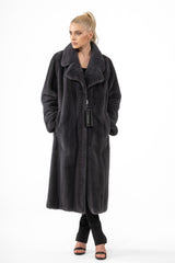 Full-length graphite mink fur coat with a wide notched collar, vertical panels, and side pockets, worn over a black outfit.