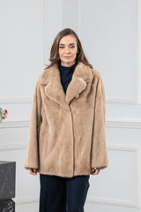 A short Palomino mink fur jacket with a wide notched collar, vertical fur grain, and a single large button closure at the upper chest.