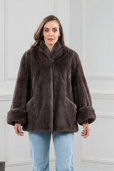 Mocca mink fur short jacket with a wide shawl collar, full-length sleeves featuring oversized cuffs, and side slit pockets.