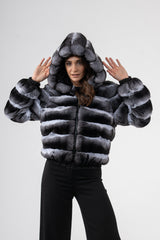 Chinchilla jacket with a grey and black horizontal-striped pattern, zip front, and large hood. Features a black ribbed hem and sleeve cuffs.