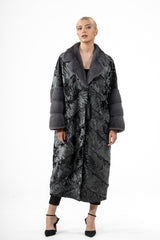 Long Swakara coat in black and silver featuring a V chevron pattern, a wide grey fur collar, and grey fur banded cuffs.