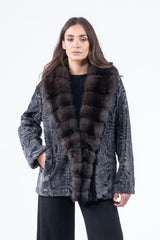 Dark grey Swakara short jacket with a wide, plush dark brown fur collar. Features a textured, wavy fur body and straight sleeves.
