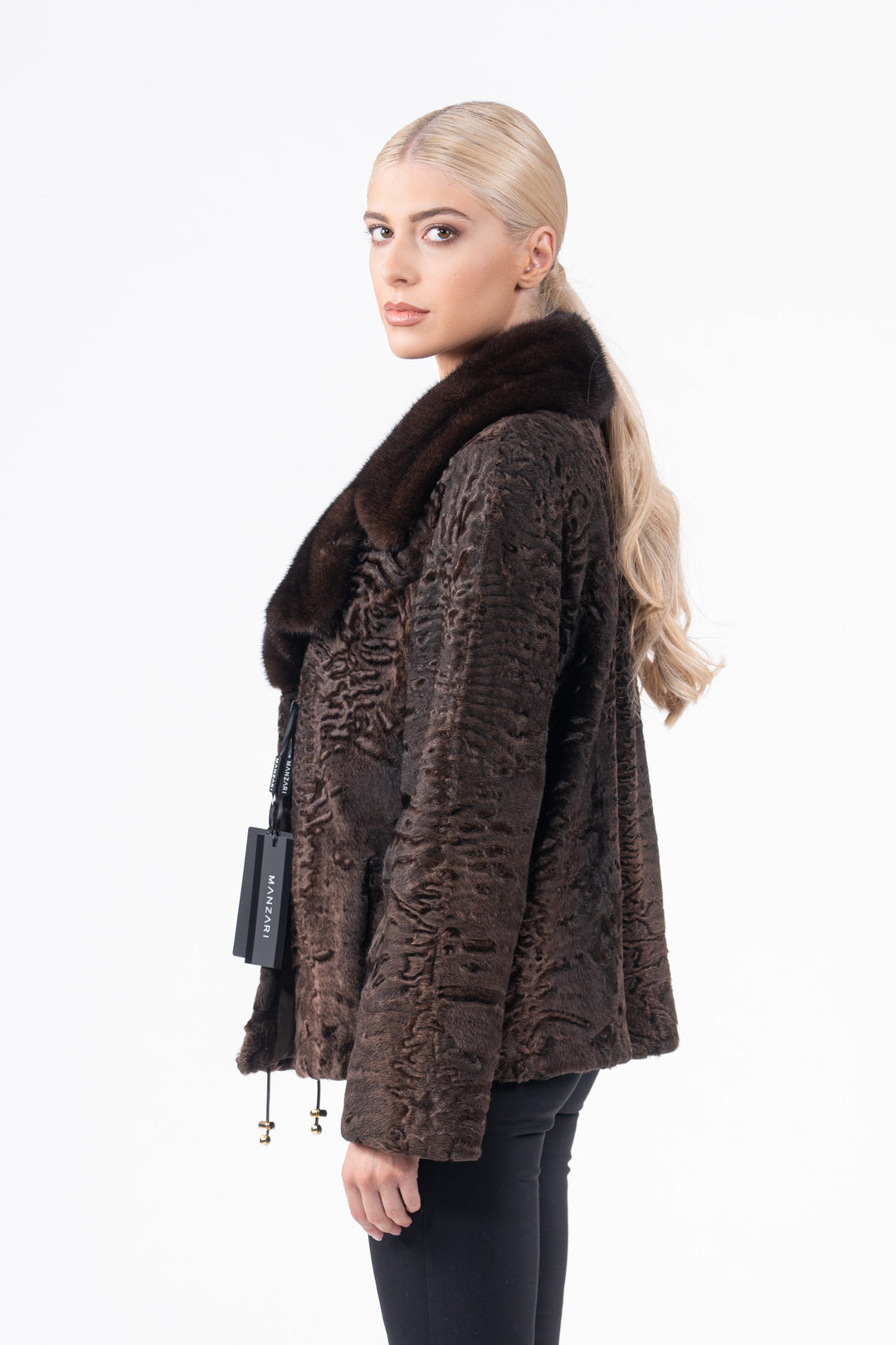 Model wearing a Chokolat Swakara fur coat by manzari