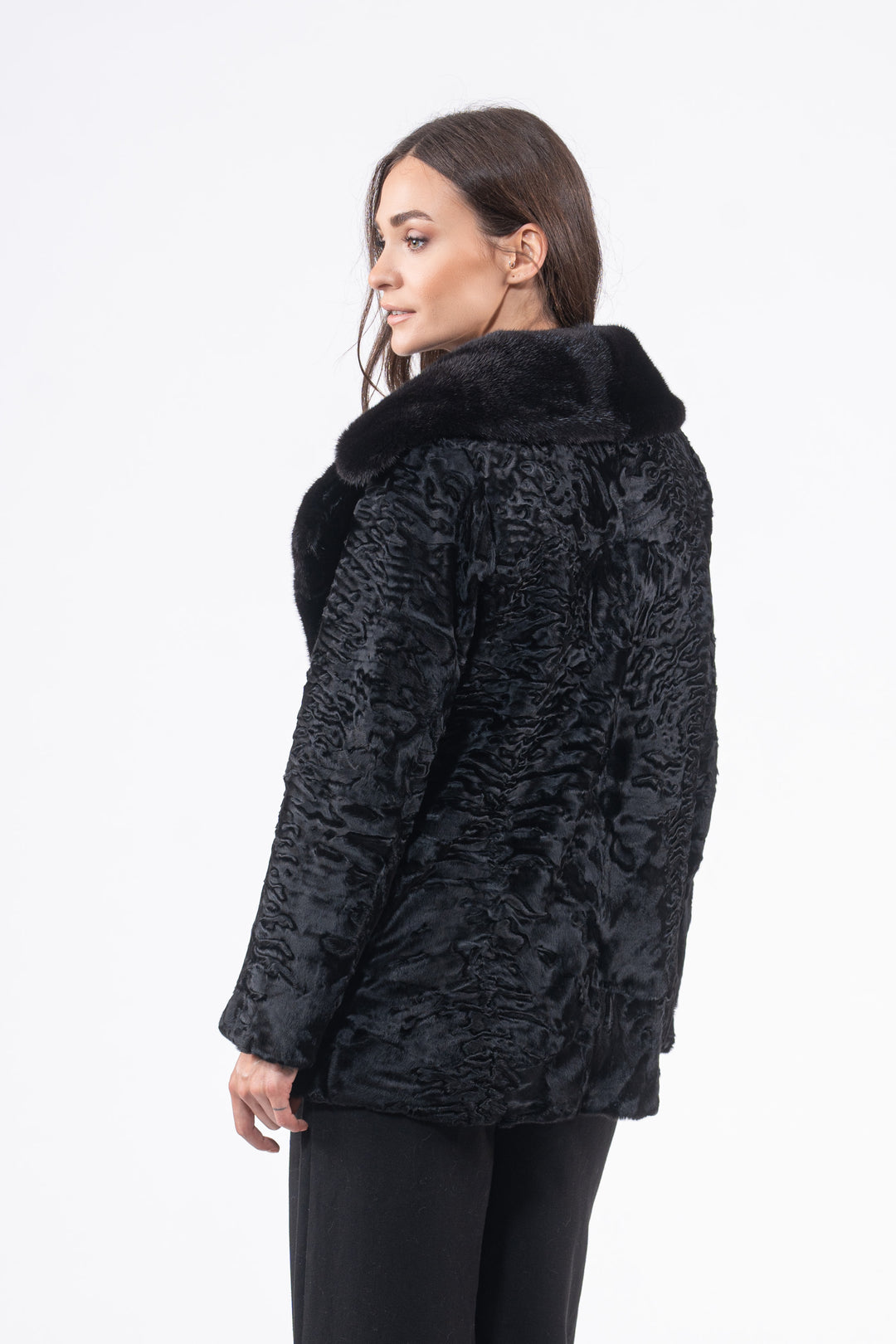 Model wearing a Black Swakara fur coat by manzari