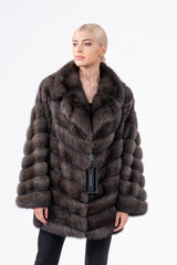 Short Russian sable jacket in dark brown, featuring a front V-chevron pattern, wide lapel collar, and long sleeves with subtle horizontal bands.