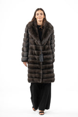 Carbonio silvery Russian sable jacket with a notched collar, featuring a full-body horizontal panel construction and a straight, knee-length fit.