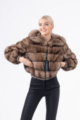 Russian sable short jacket featuring horizontal fur panels, a hood, and elasticized cuffs at the sleeves and hem, shown zipped up.