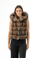 Russian sable vest in a natural brown, featuring horizontal fur panels and a deep, full fur-lined hood. Front view, hip-length, sleeveless.