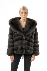 Short Russian sable jacket in a deep brown, featuring horizontal fur panels and a large integrated hood with a wide collar on a model.