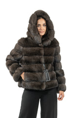 Russian sable short jacket with a hood, featuring horizontal fur panels, long sleeves, side pockets, and a front hook closure.