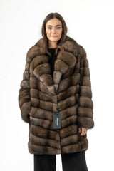 Brown Russian sable jacket with a V chevron pattern, a wide collar, and long sleeves, worn with black trousers.