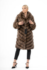 Gun metal Russian sable jacket with a soft shawl collar. The fur is pieced into a V chevron pattern throughout the body and long sleeves.