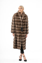 A knee-length Russian sable fur jacket featuring a boxy, horizontal-paneled texture in light brown and tan, worn open with a stand collar.