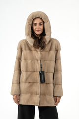 Palomino mink short jacket with a large hood and horizontal panels, displayed from the front against a white background.