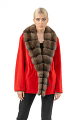 A vibrant red short jacket featuring a wide, brown mink fur collar that extends down the front in a continuous, textured panel.