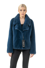 Front view of a blue mink fur jacket with a wide notched collar and straight long sleeves, hitting at the hip with a Manzari hang tag attached.