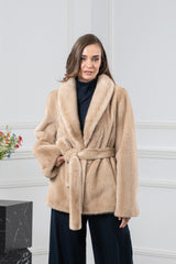 A short Palomino mink fur jacket with a shawl collar, belted waist, and straight sleeves. The fur is worked in a smooth, vertical-pelt pattern.