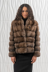 Short Russian sable jacket in brown, featuring a horizontal panel construction, a round collar, and a single round button closure at the top.