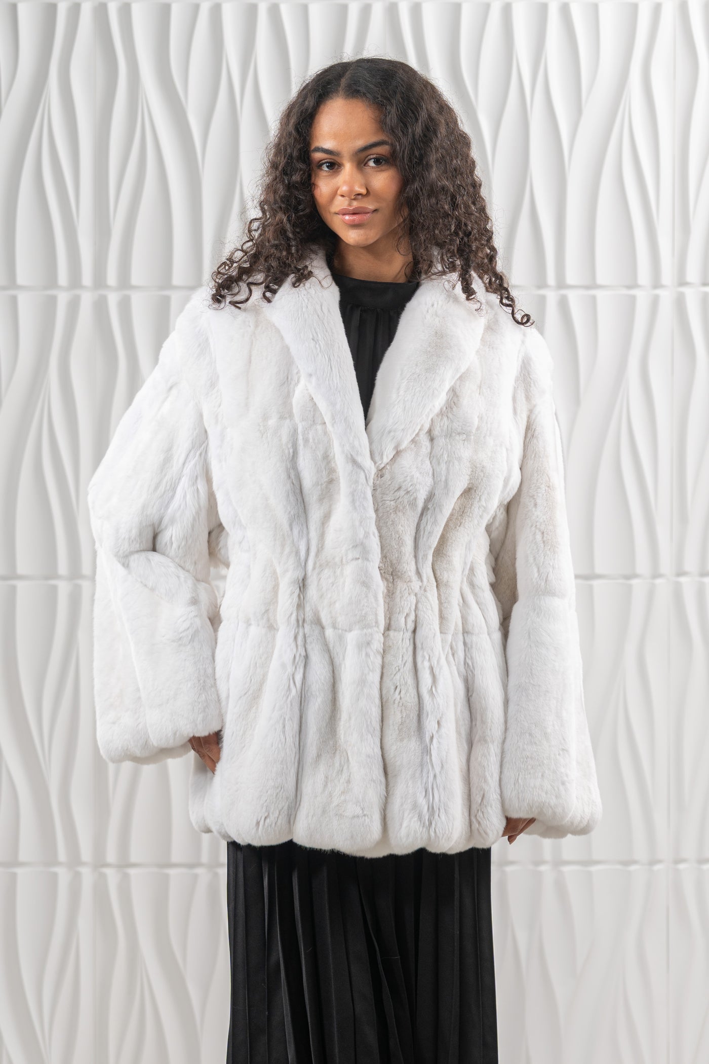Model wearing a manzari chinchilla fur coat by manzari