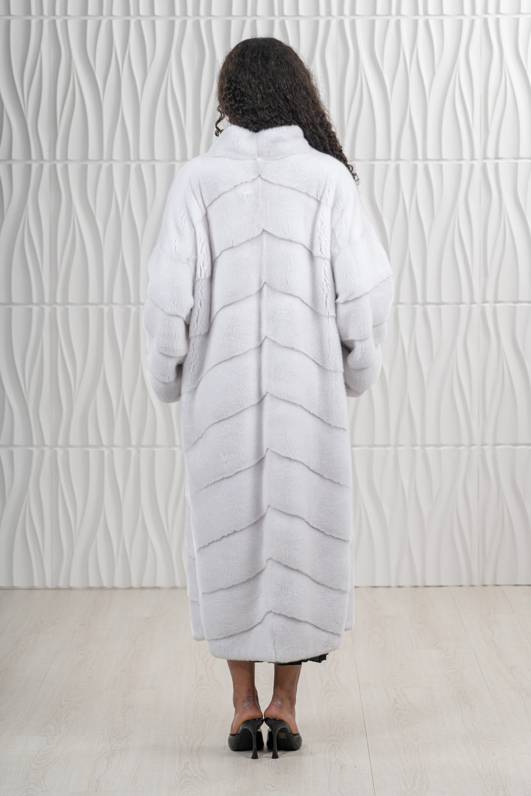 Model wearing a White Mink fur coat