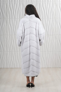 Model wearing a White Mink fur coat