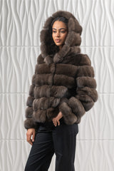 Short silvery Russian sable jacket with a hood, featuring horizontal fur panels and long sleeves.