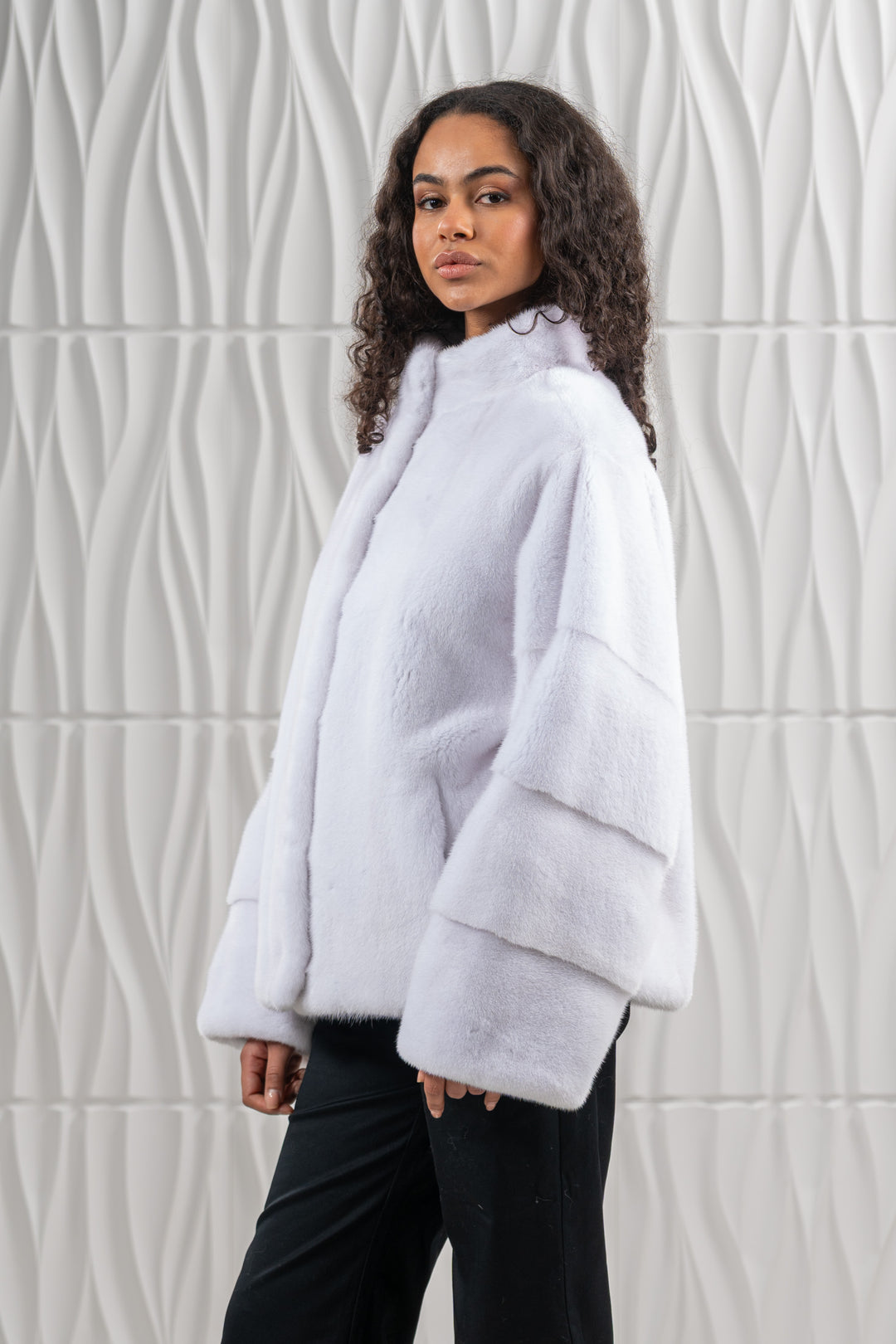 Model wearing a White Mink fur coat