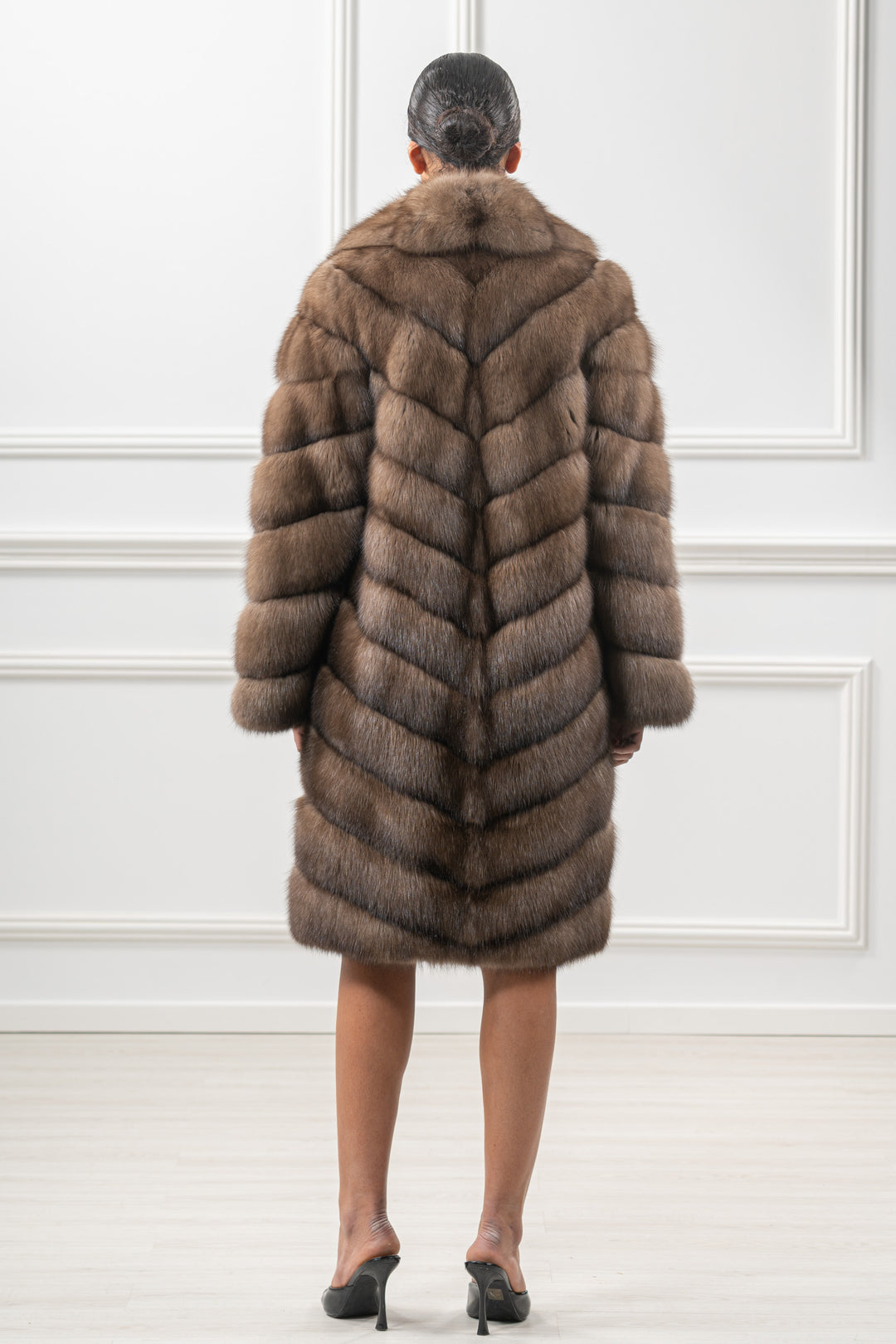 Model wearing a Platinum Russian sable fur coat by manzari