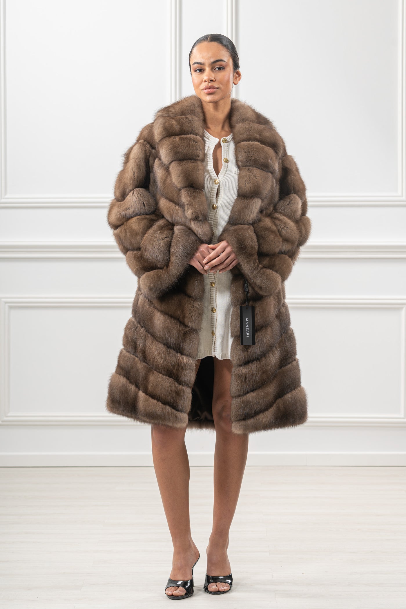 Model wearing a manzari russian sable fur coat by manzari