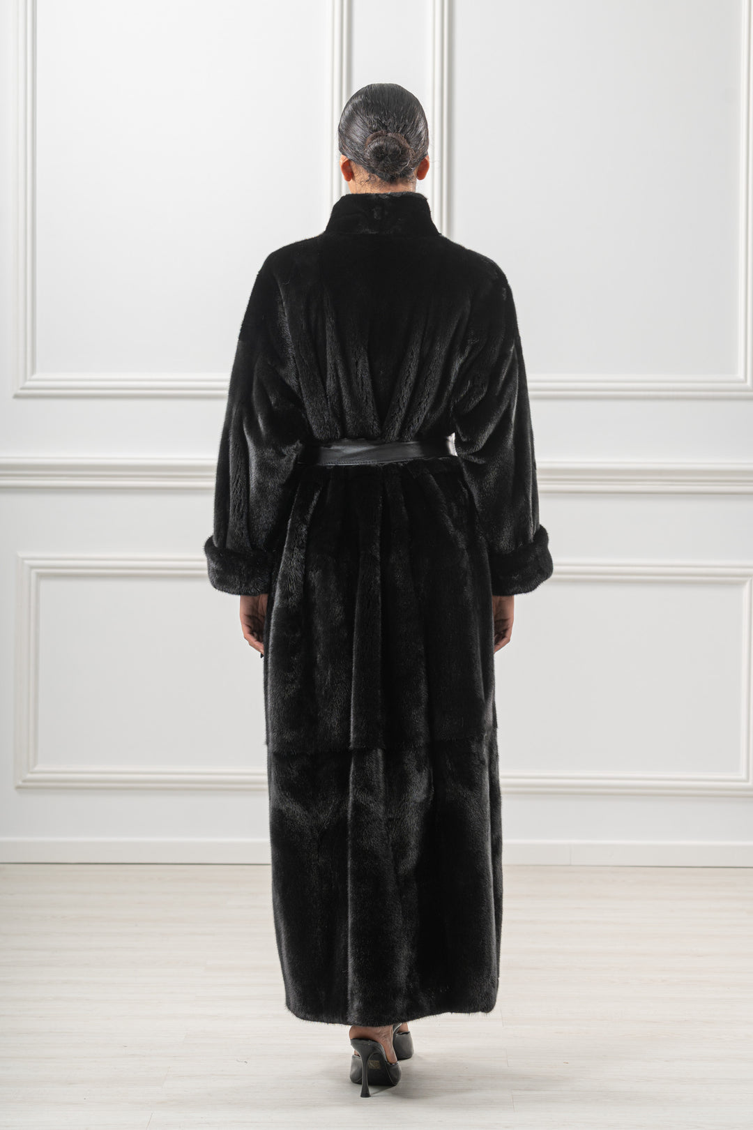 Model wearing a Black Velvet Mink fur coat