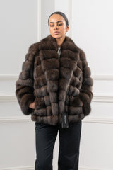 Short brown Russian sable jacket featuring a horizontal panel construction, a wide collar, and pockets at the sides.