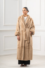 Full-length palomino mink fur coat featuring a wide notched collar, wide sleeves with turned-back cuffs, and a matching removable waist tie.