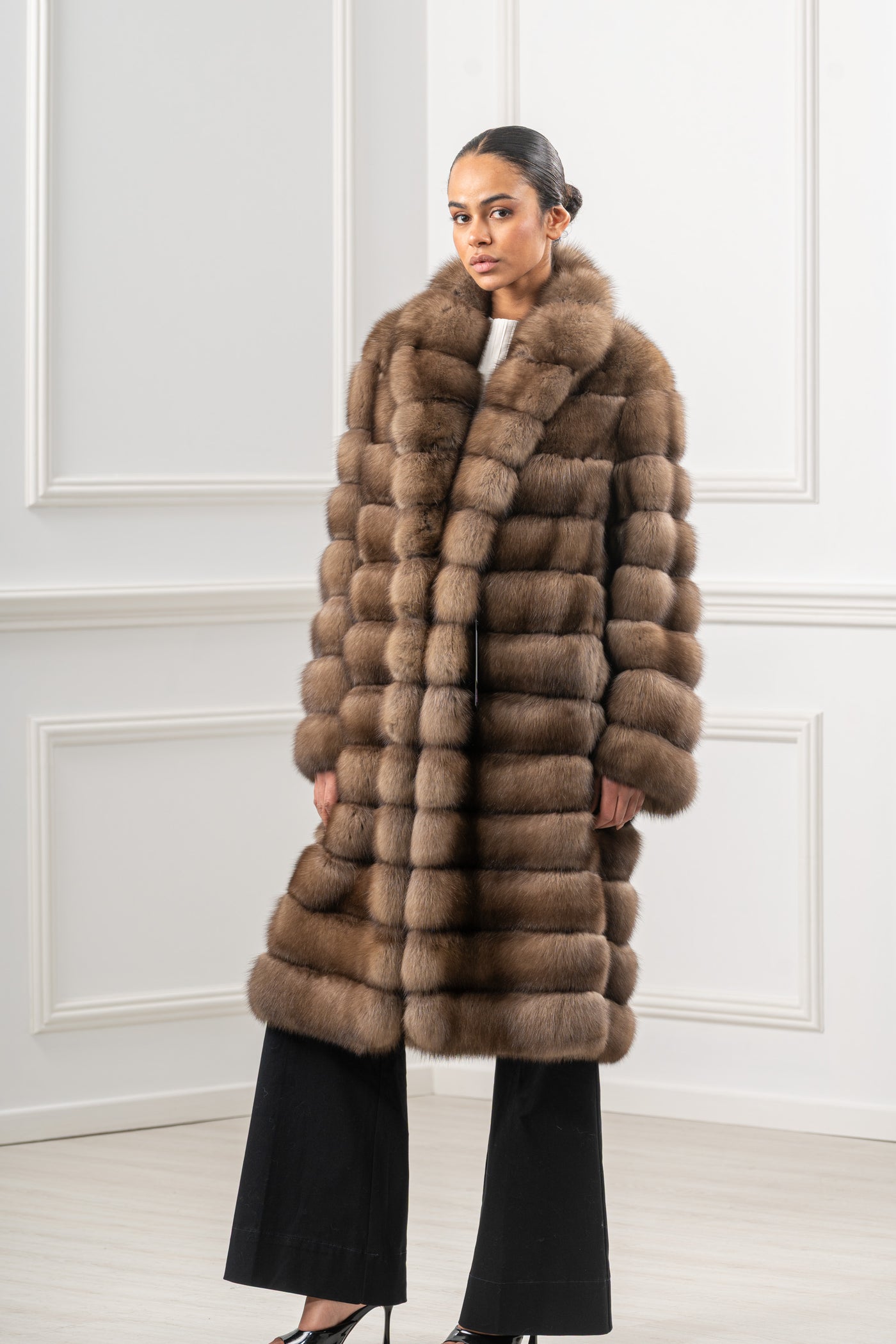 Model wearing a manzari russian sable fur coat by manzari