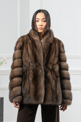 Short brown Russian sable jacket with a notched collar, featuring horizontal fur panels on the sleeves and a solid fur body.